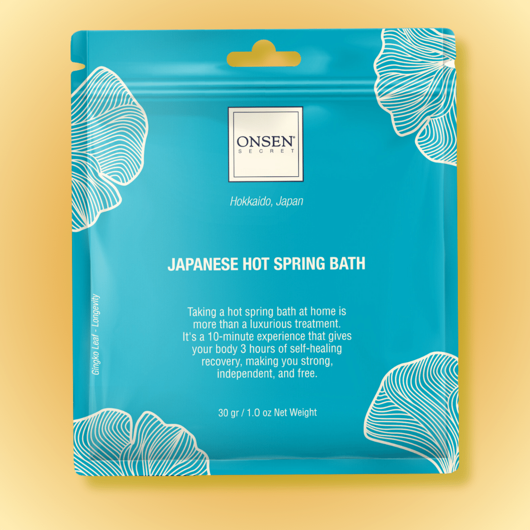 Packaging of Onsen Japanese Hot Spring Bath with blue background featuring white floral patterns and product information.