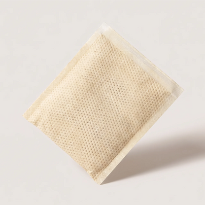 Skincare and wellness product visual, porous sachet packaging for Onsen Secret Japanese hot spring bath treatment.