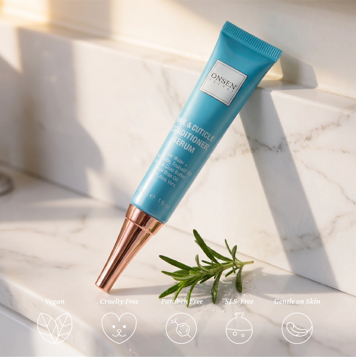 Onsen Secret Nail &amp; Cuticle Conditioner Serum packaging, turquoise tube with metallic rose‑gold cap displayed with rosemary accent, promoting eco‑friendly and nourishing formula.