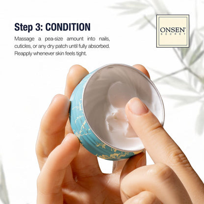 Hand holding a small container of cream with Onsen Secret branding.