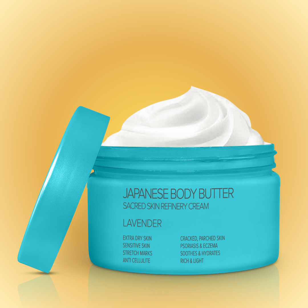 A jar of Japanese Body Butter with the lid off, showing the creamy texture of the product inside. The jar is labeled with the product name and benefits like &