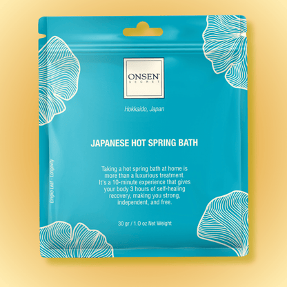 Packaging of Onsen Japanese Hot Spring Bath with blue background featuring white floral patterns and product information.