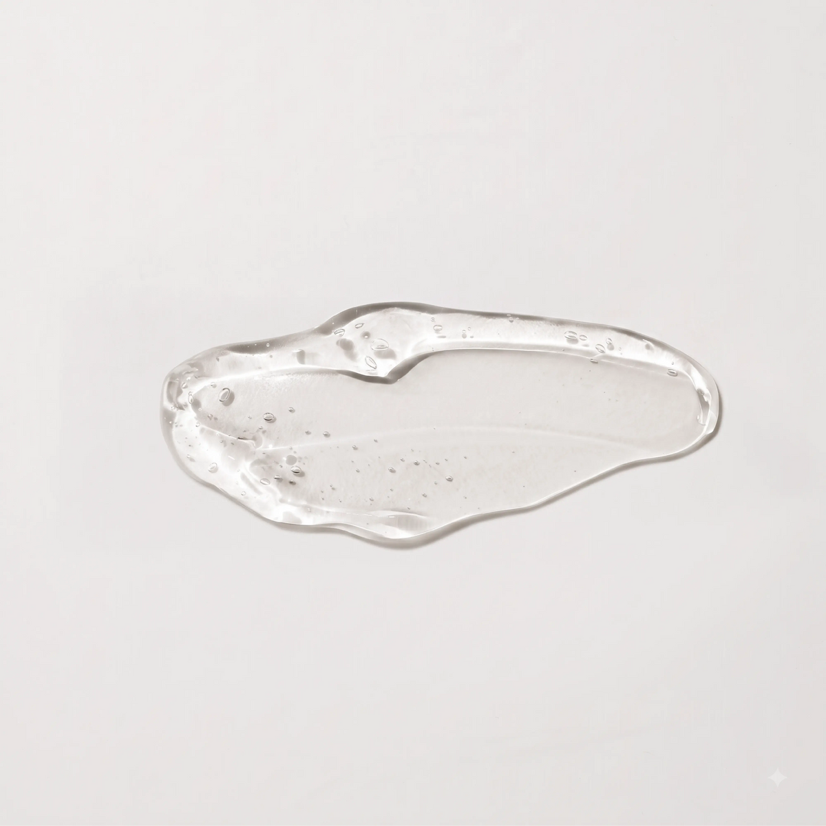Onsen Secret facial peel product texture, clear viscous gel highlighting self‑liquifying exfoliation formula.