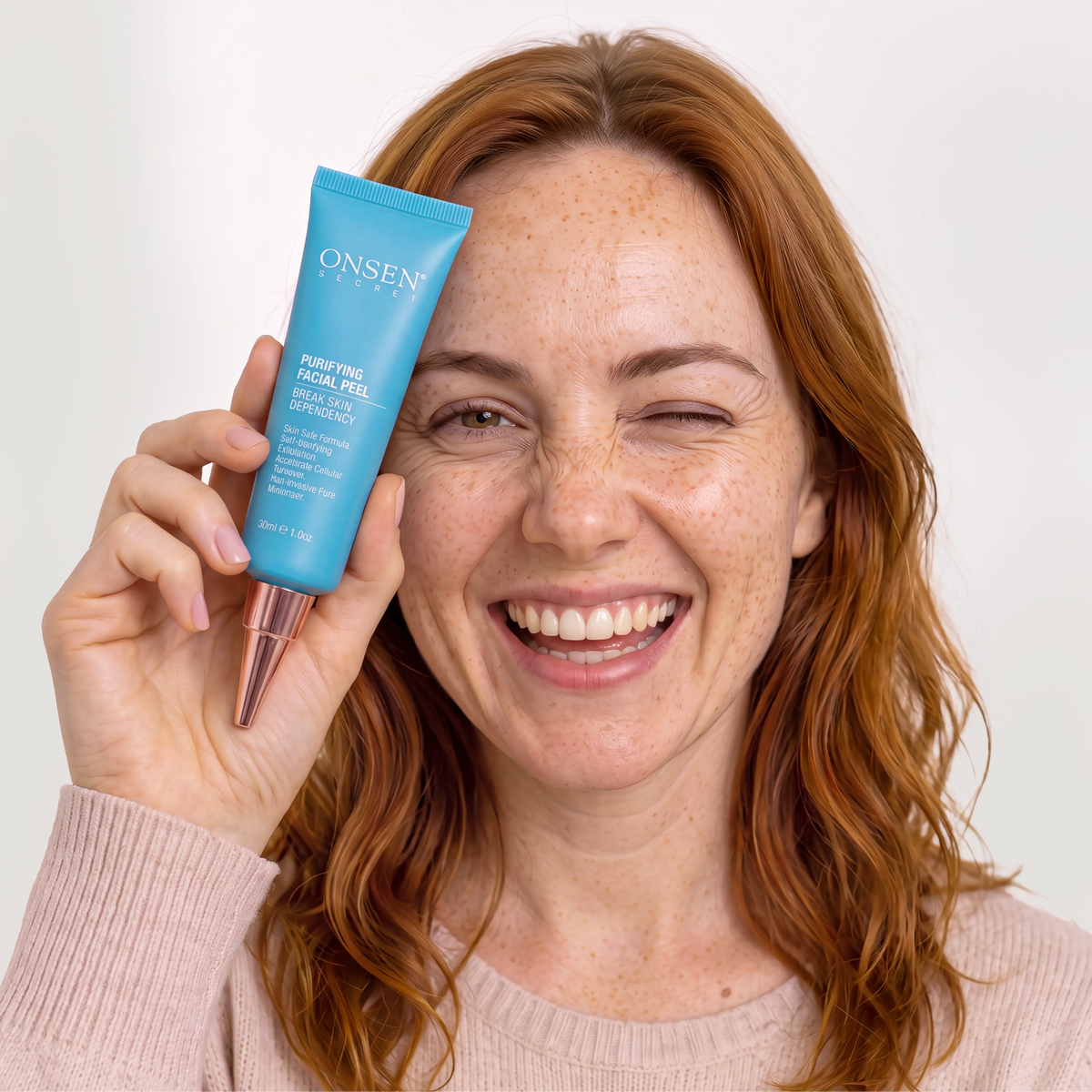 Onsen Secret Purifying Facial Peel 1oz tube, person showcasing exfoliating and mineral‑rich skincare formula.