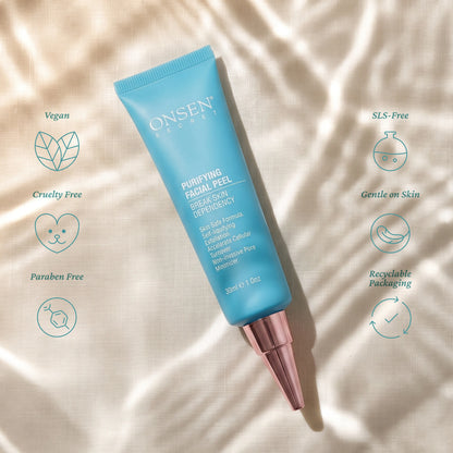 Onsen Secret Purifying Facial Peel, 30ml blue tube with rose cap on fabric background, highlighting vegan, cruelty free, paraben free, SLS free, gentle on skin, and recyclable packaging.