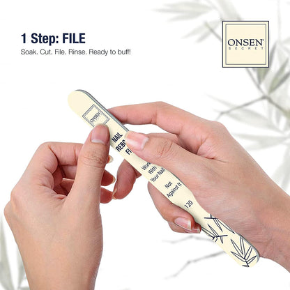 Onsen Secret nail file being held by a hand with a white background