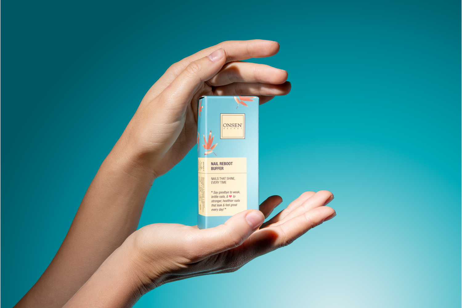 Hand holding a clear container with a blue gradient background