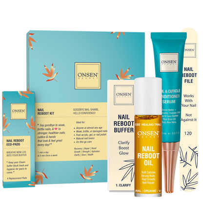 A collection of nail care products from ONSEN, including a nail reboot kit with a blue and white box, a nail &amp; cuticle conditioning serum, nail reboot oil, a buffer block, and a nail file, all laid out on a light background.