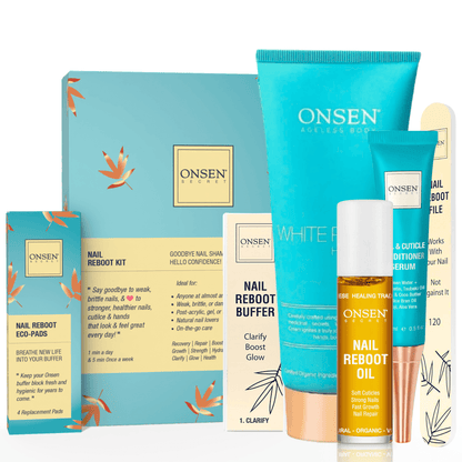 A collection of nail care products from Onsen Secret including a nail &amp; cuticle conditioning serum, nail reboot oil, a 3-way shining buffer block with replacement pads, nail reboot file, and a white pagoda hand cream, all laid out on a light background.